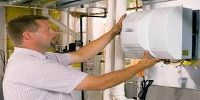 man installing humidifier 