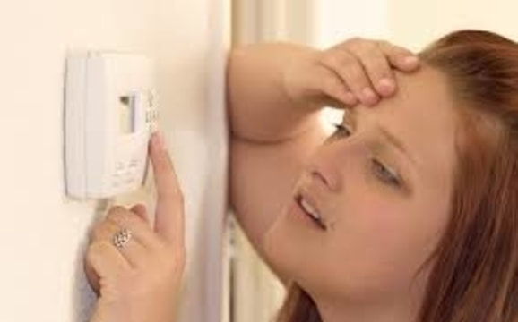 woman with broken thermostat